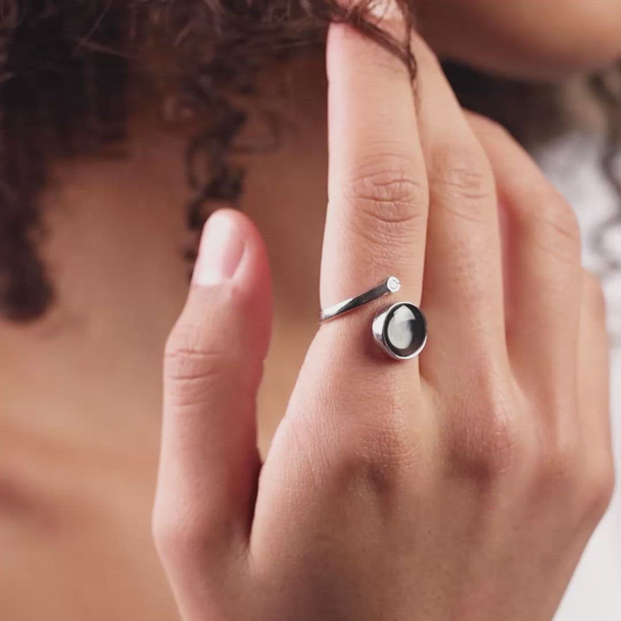 Video of woman wearing adjustable moon phase Cosmic Spiral Ring in Rhodium