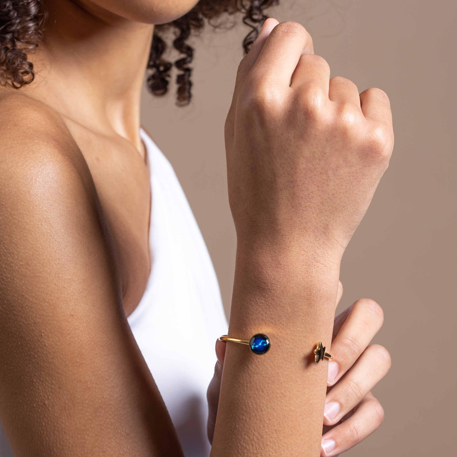 Woman wearing Gold plated constellation astrology star cuff