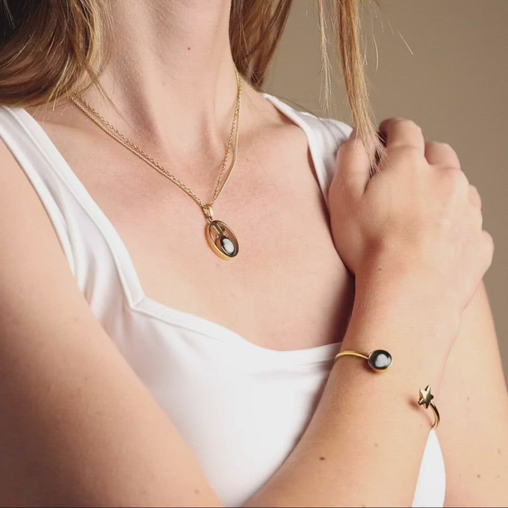 Video of woman wearing Stella Necklace in Gold and Crépuscule Cuff in Gold