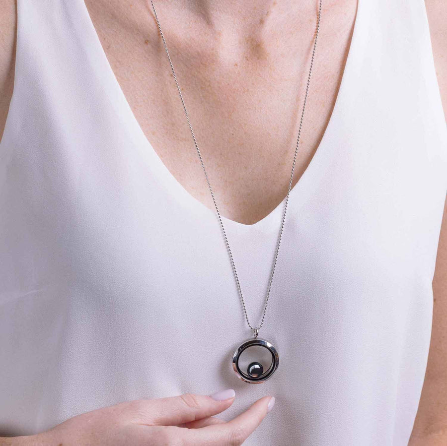 Woman wearing One Moon Locket in Stainless Steel around neck